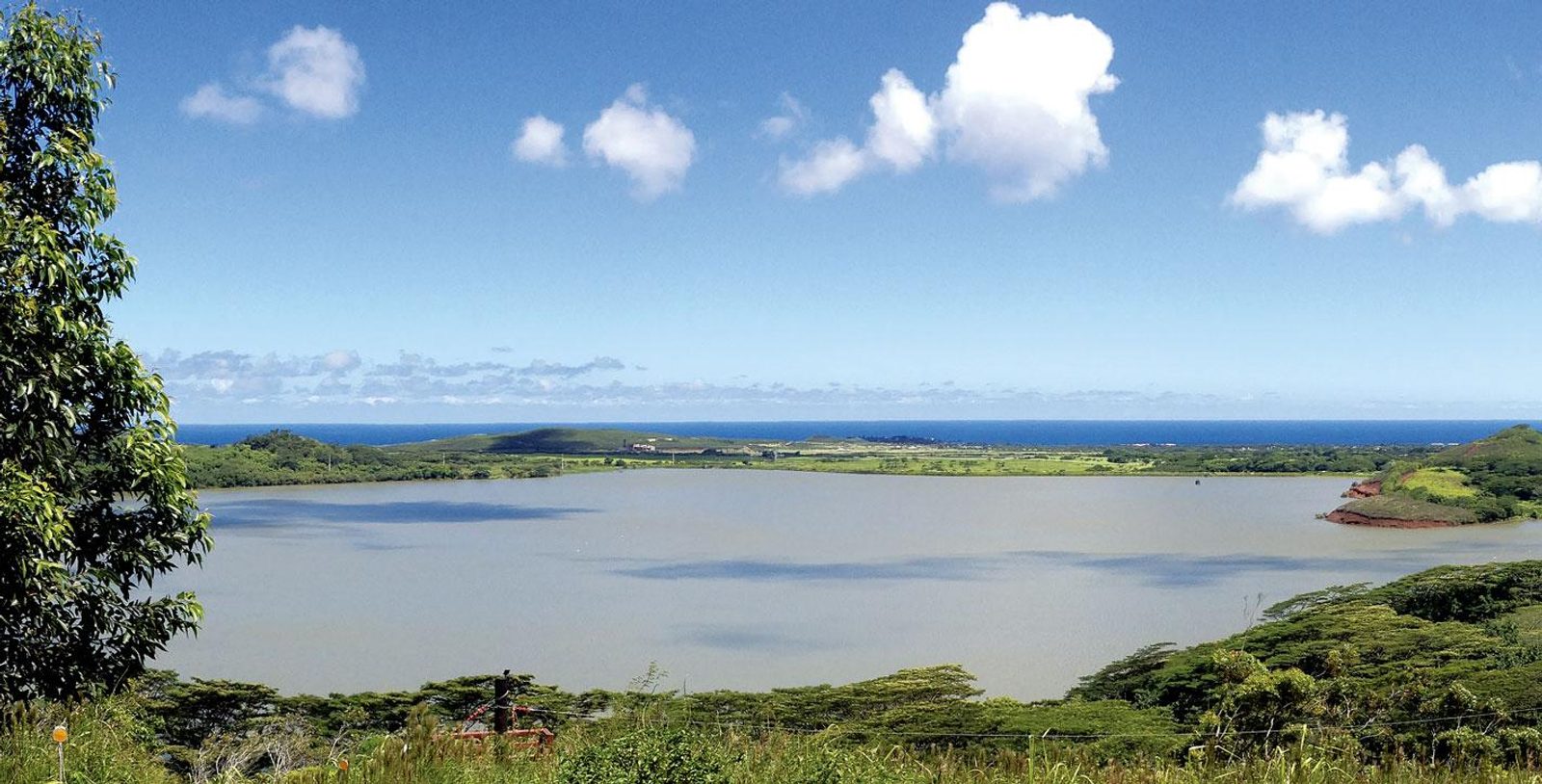 The Waita Reservoir from above with the south shore coastline and the ocean in the distance